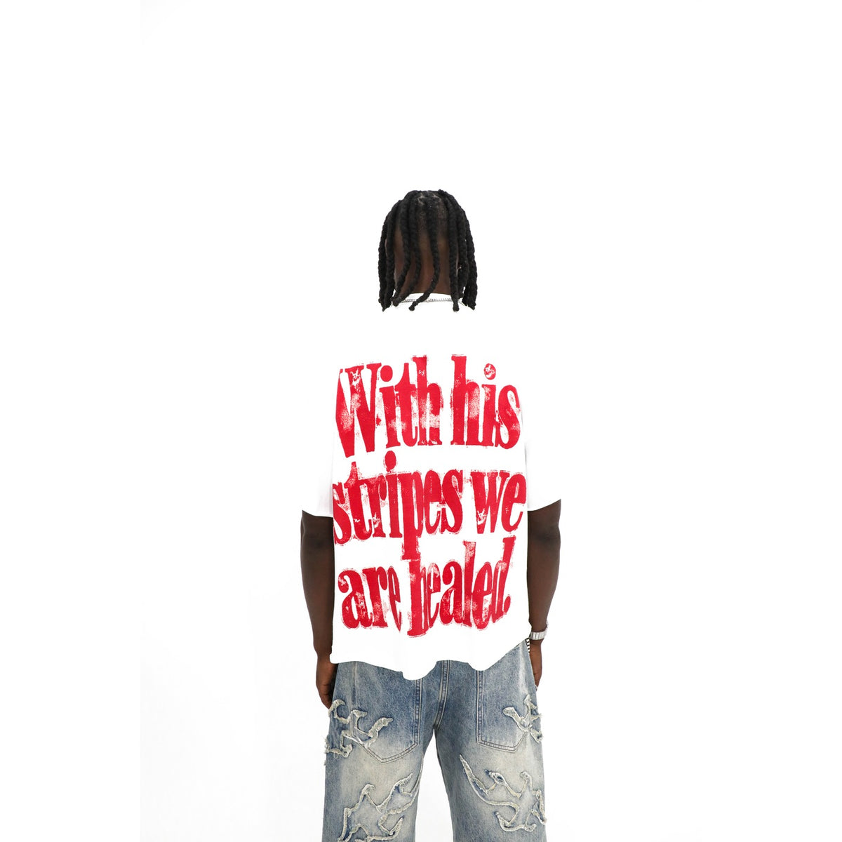 Saint tee, back detail — raw cut hem and distressed red lettering