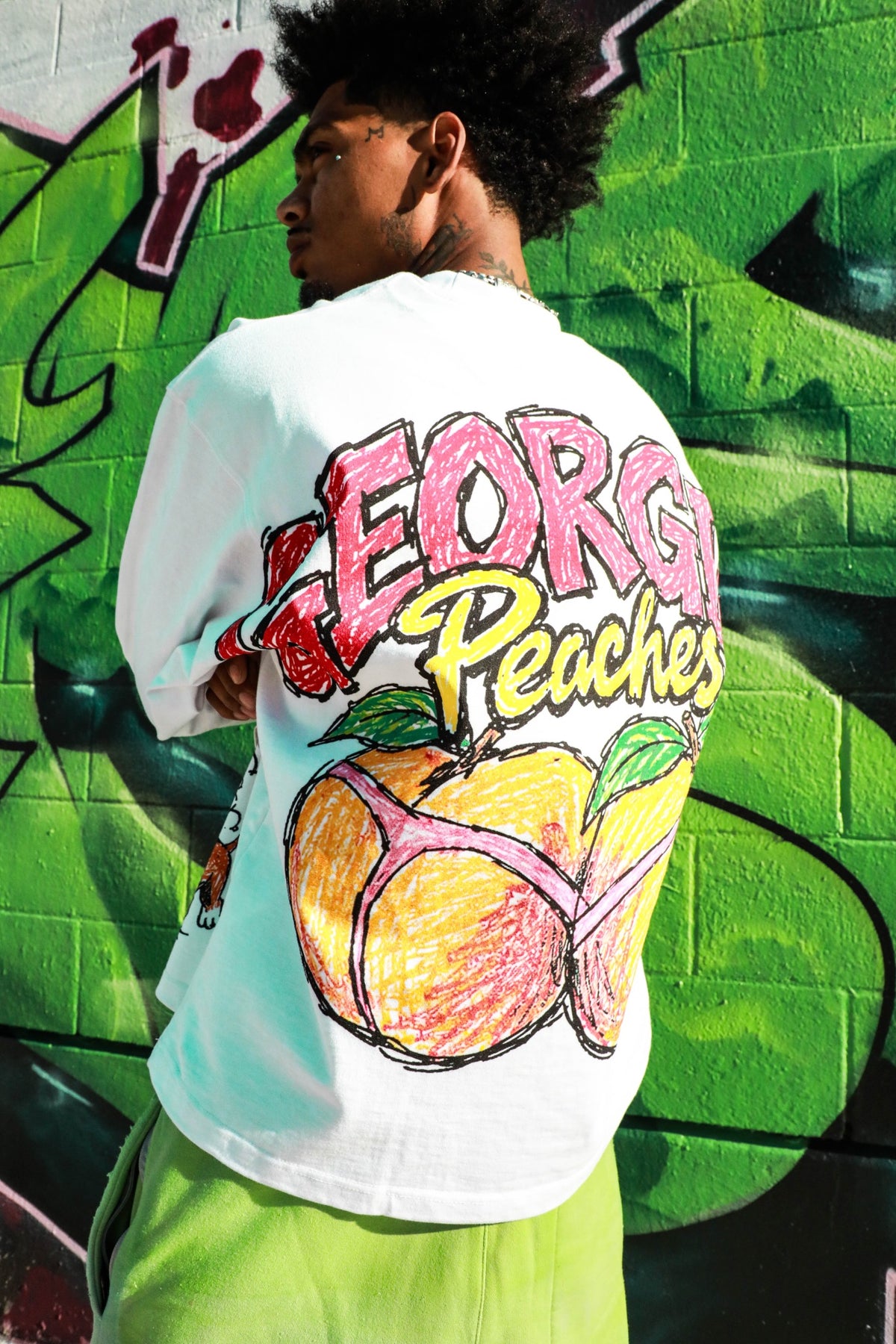 Model wearing Georgia's Finest Long Sleeve — Georgia Peaches back view