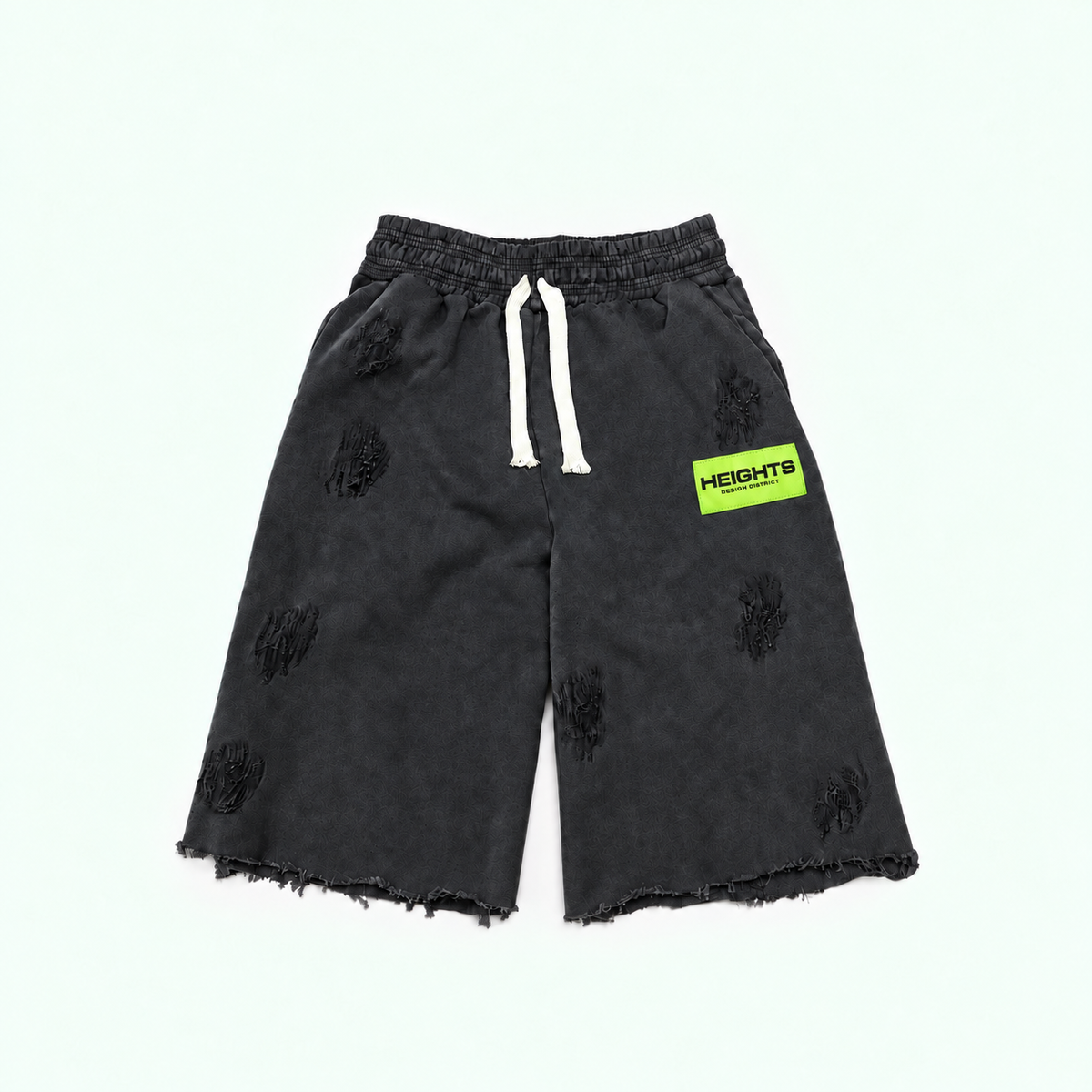 Heights Essential Short flat lay in Vintage Black — neon green woven label, distressed 450 GSM fleece, raw-cut hem