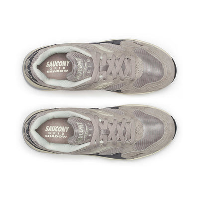 Saucony Grid Shadow 2 running shoes with a sleek design and layered gray and black colorway, displayed on a plain background.
