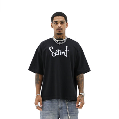 Black Arch Angel T-shirt by Saint Heights featuring a detailed angel wing graphic on the front.