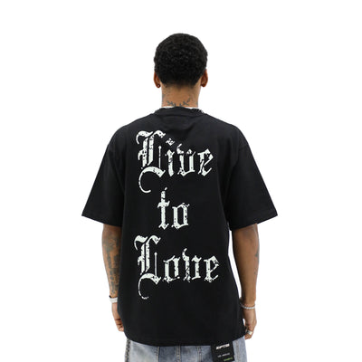 Aimer Vivre Angel & Palms T-shirt featuring a floral and angel graphic design on a casual cotton shirt.