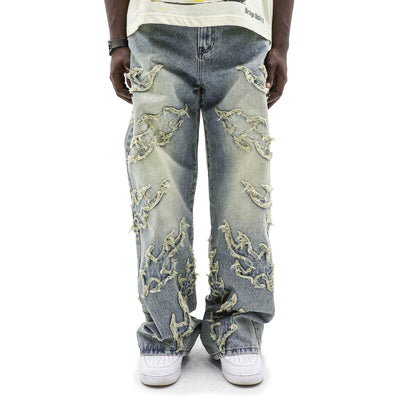 HeightsDistrict Inferno distressed denim jeans with ripped details and a casual fit, displayed on a neutral background.