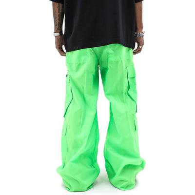 Neon parachute cargo pants from HeightsDistrict featuring bright neon fabric, multiple pockets, and a relaxed fit.