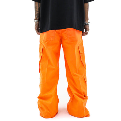 Neon parachute cargo pants by HeightsDistrict featuring bright neon colors, multiple pockets, and a relaxed fit.