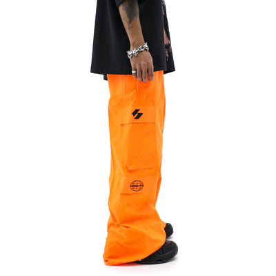 Neon parachute cargo bag from HeightsDistrict with adjustable straps and bright neon color, designed for secure outdoor storage.