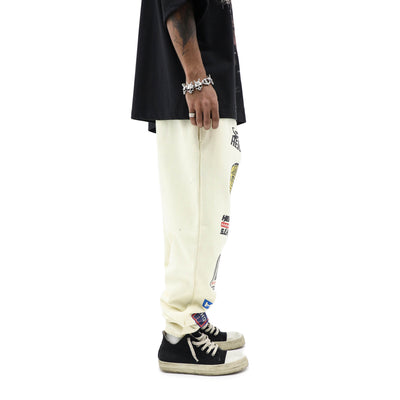 HeightsDistrict varsity jogger pants in black with white side stripes, relaxed fit and elastic waistband, casual athletic style.