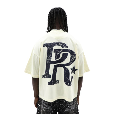 Public Relations "It's All Love (Until It's Not)" T-shirt featuring bold black print on a white cotton fabric.