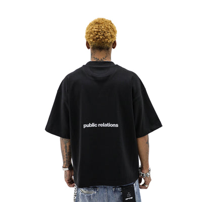 Black T-shirt from Public Relations titled The Worm featuring a graphic design on the front.