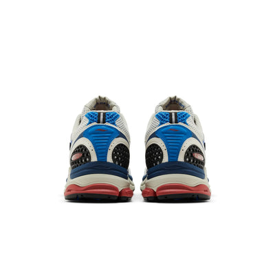 Saucony ProGrid Triumph 4 shoes in blue and rust, showcasing the sleek design and cushioning features.