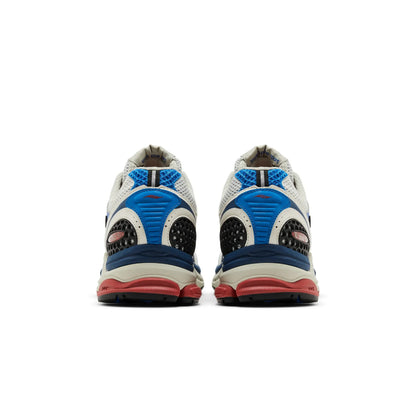 Saucony ProGrid Triumph 4 shoes in blue and rust, showcasing the sleek design and cushioning features.