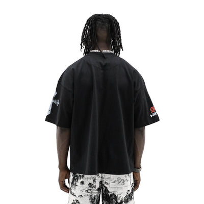 Black Saint Heights T-shirt with "Only God Can Judge Me" printed in white, casual fit, and front graphic design.