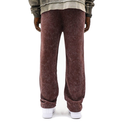 Black Island creased jogger top in black, featuring a relaxed fit and stylish design, shown on a model.