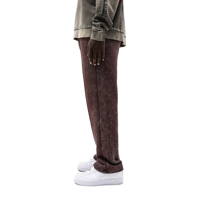 Black Island creased jogger top in black, featuring a relaxed fit with pleated details and casual style, shown on a model.