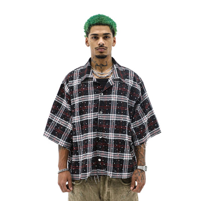Black rhinestone flannel top by HeightsDistrict, featuring a soft fabric with sparkling rhinestone accents and button closure.