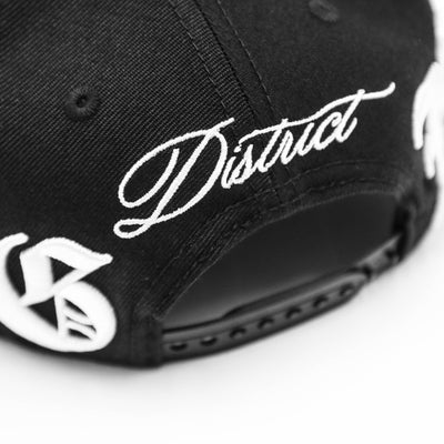 HeightsDistrict Crown LE Snapback headwear with a structured design and adjustable strap, front logo detail.