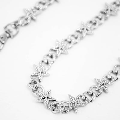 HeightsDistrict Shooting Star wallet chain featuring a sleek metal design with star-shaped links and secure clip attachments.