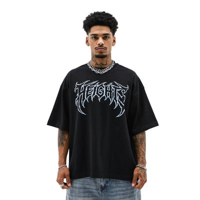 Saint Heights Heights Electrica T-shirt featuring a vibrant electric-themed graphic on a casual cotton shirt.