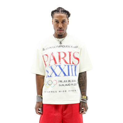 HeightsDistrict Olympic XXXIII T-Shirt with bold Olympic logo and vibrant design on white fabric.