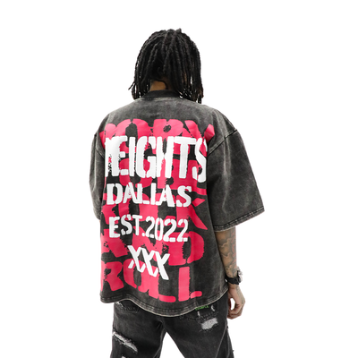 HeightsDistrict Rock N Roll T-Shirt featuring a bold rock graphic on black cotton fabric.