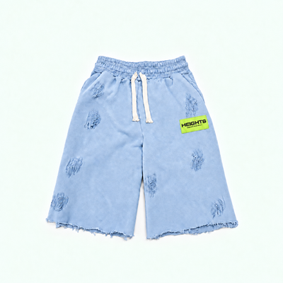 Heights Essential Short flat lay in Vintage Blue — neon green woven label, distressed 450 GSM fleece, raw-cut hem
