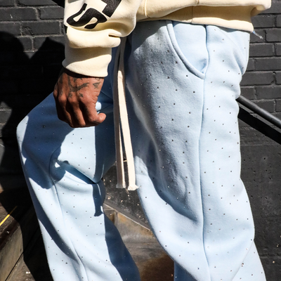 HeightsDistrict rhinestone flare pants with sparkling embellishments and flared leg design, shown on a white background.