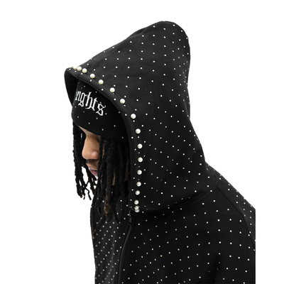 Pearl Stone Hoodie by HeightsDistrict featuring a soft fabric with pearl-like stone embellishments on the front and sleeves.