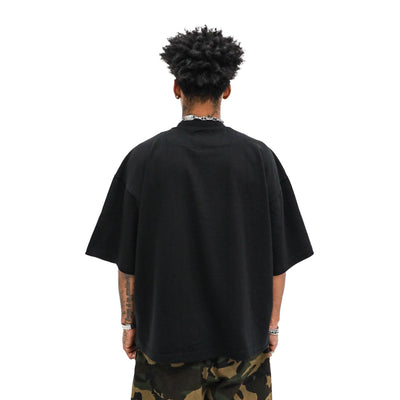 Vamp Tee - Black worn on model, back view, on a white background